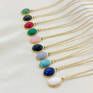 Detailed close-up of colorful oval natural stone pendants with elegant gold plating