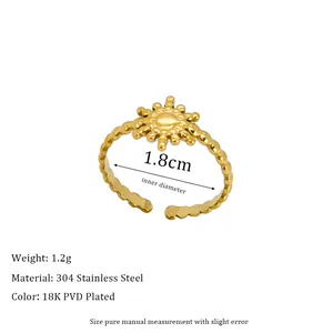 Detail showing 1.8cm inner diameter and starburst design on 18K PVD gold ring