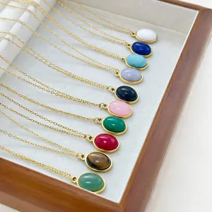 Multiple oval natural stone pendant necklaces in various colors with golden chains