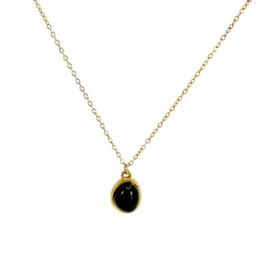 Vintage 18K gold plated titanium steel necklace featuring a polished black oval pendant