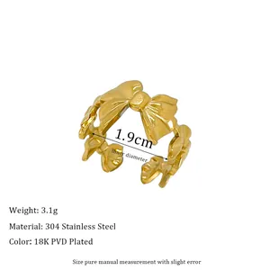 Detail of 18K gold plated bow ring with 1.9cm inner diameter and 3.1g weight specs