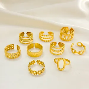 8-piece set of gold-plated stainless steel open rings on elegant white silk fabric
