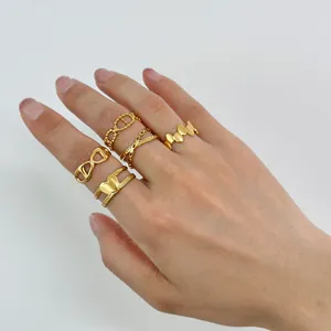 Close-up of a 5-piece set of stackable 18K gold plated stainless steel rings for women
