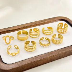 Set of 9 18k gold plated stainless steel adjustable rings with geometric patterns