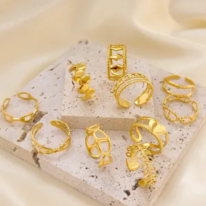 Detailed display of vintage 18K gold plated adjustable open rings with varied patterns