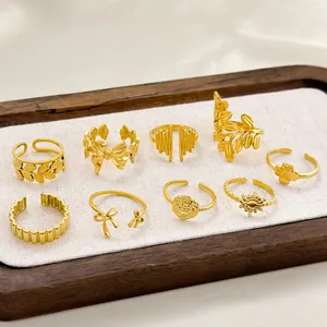 Nine-piece vintage gold-plated titanium steel ring set with floral and leaf motifs