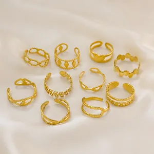 Detail of 10-piece gold-plated stainless steel rings set with varied hollow designs