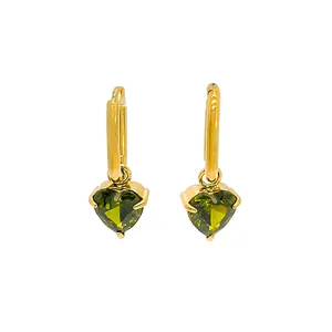 Elegant gold heart earrings with green zircon pendants on a white background