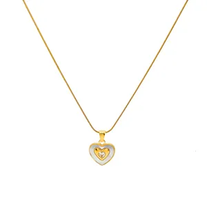 Golden heart pendant necklace with white shell inlay and zircon on a gold chain