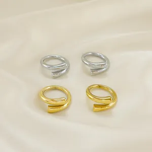 Modern minimalist stainless steel spiral rings in polished gold and silver finishes