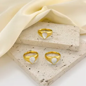 Three gold-plated stainless steel chunky rings with teardrop mother of pearl inlays