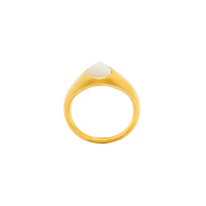Minimalist gold teardrop ring with a white cabochon stone in a polished finish