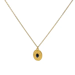 Collier vintage français en acier inoxydable doré avec pendentif ovale et pierre bleue