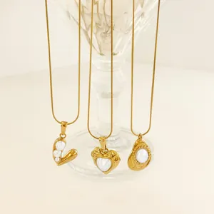 Three vintage 18k gold plated snake chain necklaces with heart and pearl pendants
