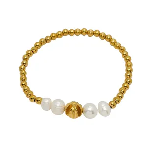 Elegant 18K gold-plated beaded bracelet with white pearls and a grooved pumpkin charm