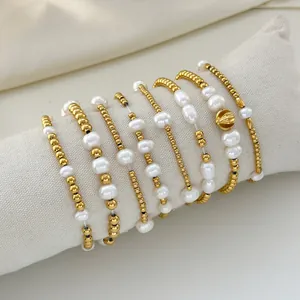 Set of 7 elegant pearl and 18K gold stainless steel bead bracelets with shell charm