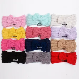 Flat lay of knit bow baby headbands in twelve assorted colors for autumn and winter