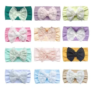 Detail view of 12-piece set featuring lace bow headbands in various pastel colors