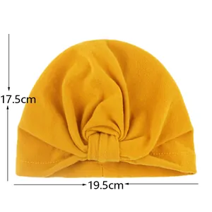 Detailed size measurement showing ginger yellow baby turban hat with 17.5x19.5cm dimensions