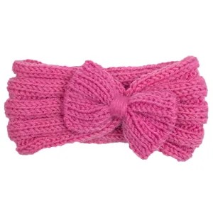 Rose pink cable knit baby headband with a large bow for winter warmth and style