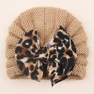 Baby knit beanie hat in khaki with a large leopard print bow for autumn and winter wear
