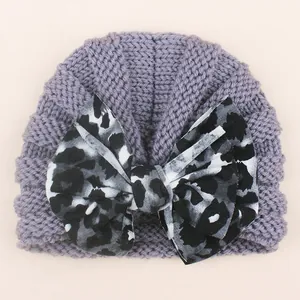 Baby purple grey knit hat featuring a stylish leopard print bow for infant winter warmth