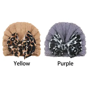 Knit baby turban hats with leopard print bows in yellow and purple shades