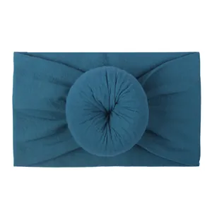 Peacock blue baby nylon headband with soft ribbed knit fabric and donut knot detail