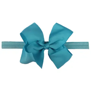 Detail of light blue ribbed bow headband showing texture and elastic nylon strap