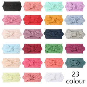 Detailed grid showing 23 colors of soft nylon baby turbans with rabbit ear knots