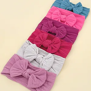 6-pack of soft stretchy baby headbands with large bows in assorted vibrant colors