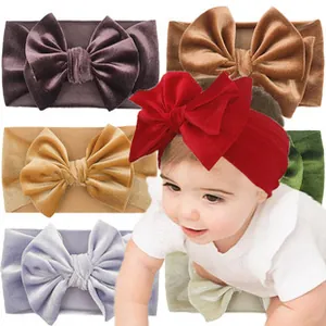 Soft velvet baby headbands with large bows in red, purple, brown, gold, blue, and green