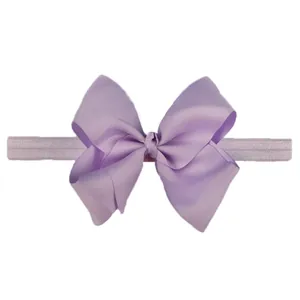Macro detail of lilac baby headband with textured grosgrain bow and elastic band