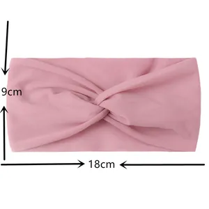 Pink knotted kids headband with dimensions of 18cm width and 9cm height on white background