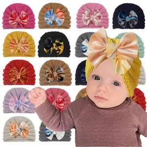 Knitted baby turban hats with velvet bows in fifteen diverse colors and patterns