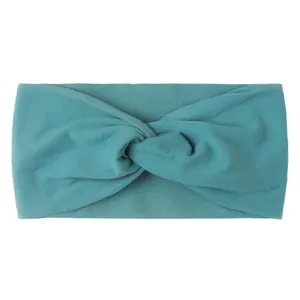 Detail of teal knotted nylon headband featuring soft knit texture and high elasticity