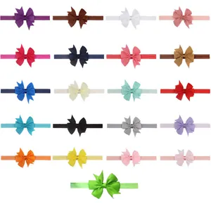 Selección de 21 diademas elásticas de colores con lazos de cinta para bebés y niños