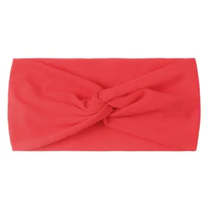 Close-up of bright red twisted nylon baby headband with soft elastic knit fabric