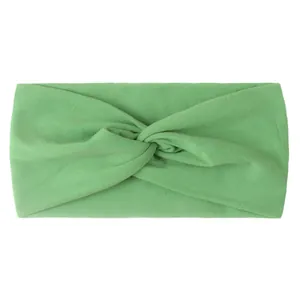 Detail of fruit green knotted baby headband showing soft ribbed texture and elastic design