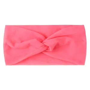 Detail of rose pink elastic knotted hair band with soft plush velvet fabric texture