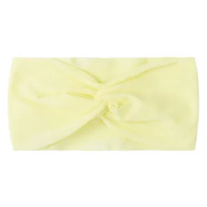 Detail of soft pale yellow knotted turban hair band in ribbed stretchy nylon fabric