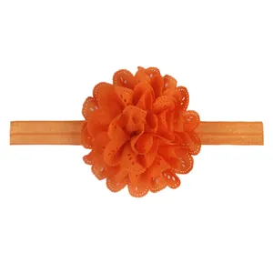 Détail du bandeau fleur en dentelle orange vif avec une grande élasticité pour bébés