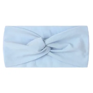 Detail view of light blue wide nylon hair band with a knotted cross design for babies