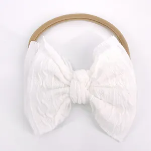 Bandeau bébé avec nœud blanc en tricot torsadé et bandeau en nylon sans couture