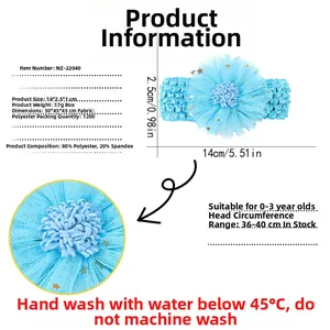 Detail view of sky blue knitted baby headband with flower showing size and fabric specs