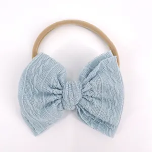 Bandeau bébé doux avec nœud jacquard bleu clair et ruban en nylon sans couture
