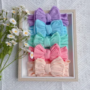 5-piece set of cable knit nylon headbands with double layered bows for baby girls