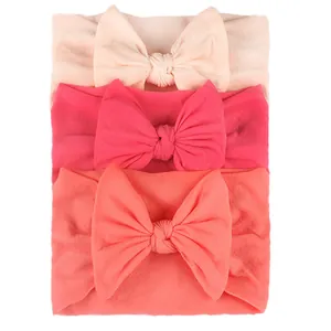 3pcs baby nylon headbands with large bows in pink, rose, and coral orange colors