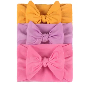 3-pack elastic baby headbands with large soft nylon bows in yellow, purple, and pink