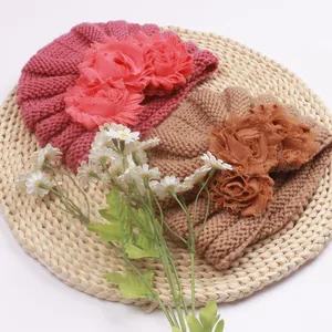 Winter infant knit beanies with large fabric flowers in rose red and camel colors